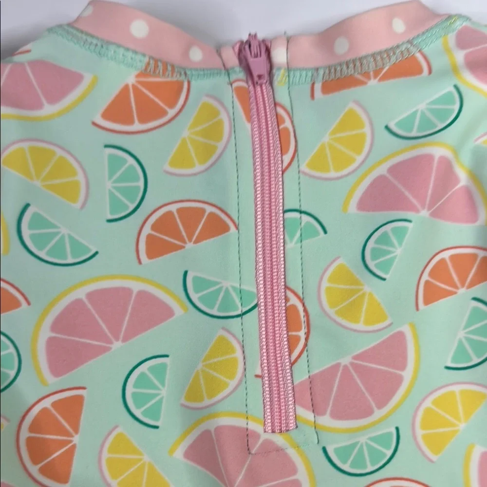 Ruffle Butts Baby Girls Squeeze The Day Pink and Green Citrus One Piece Swimsuit
